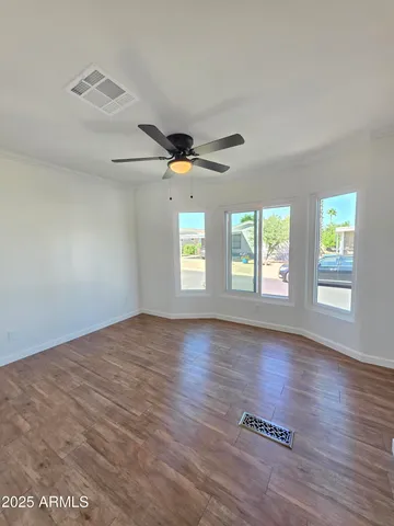 a bathroom with a granite countertop toilet a sink and a mirror