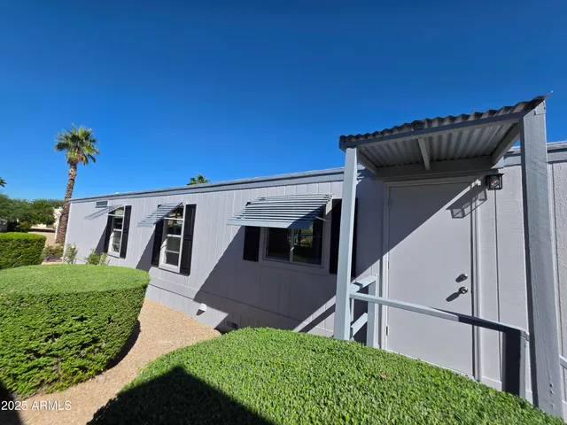 a view of outdoor space with signage and flags