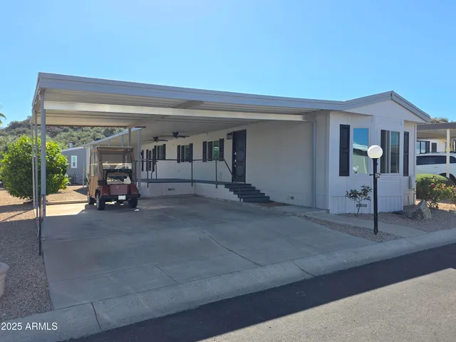 a view of a livingroom with furniture and a garage