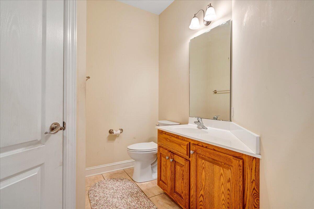 625 Frontier Way Fincastle, VA 24090 - Photo 46 of 105 a bathroom with a granite countertop sink and a mirror