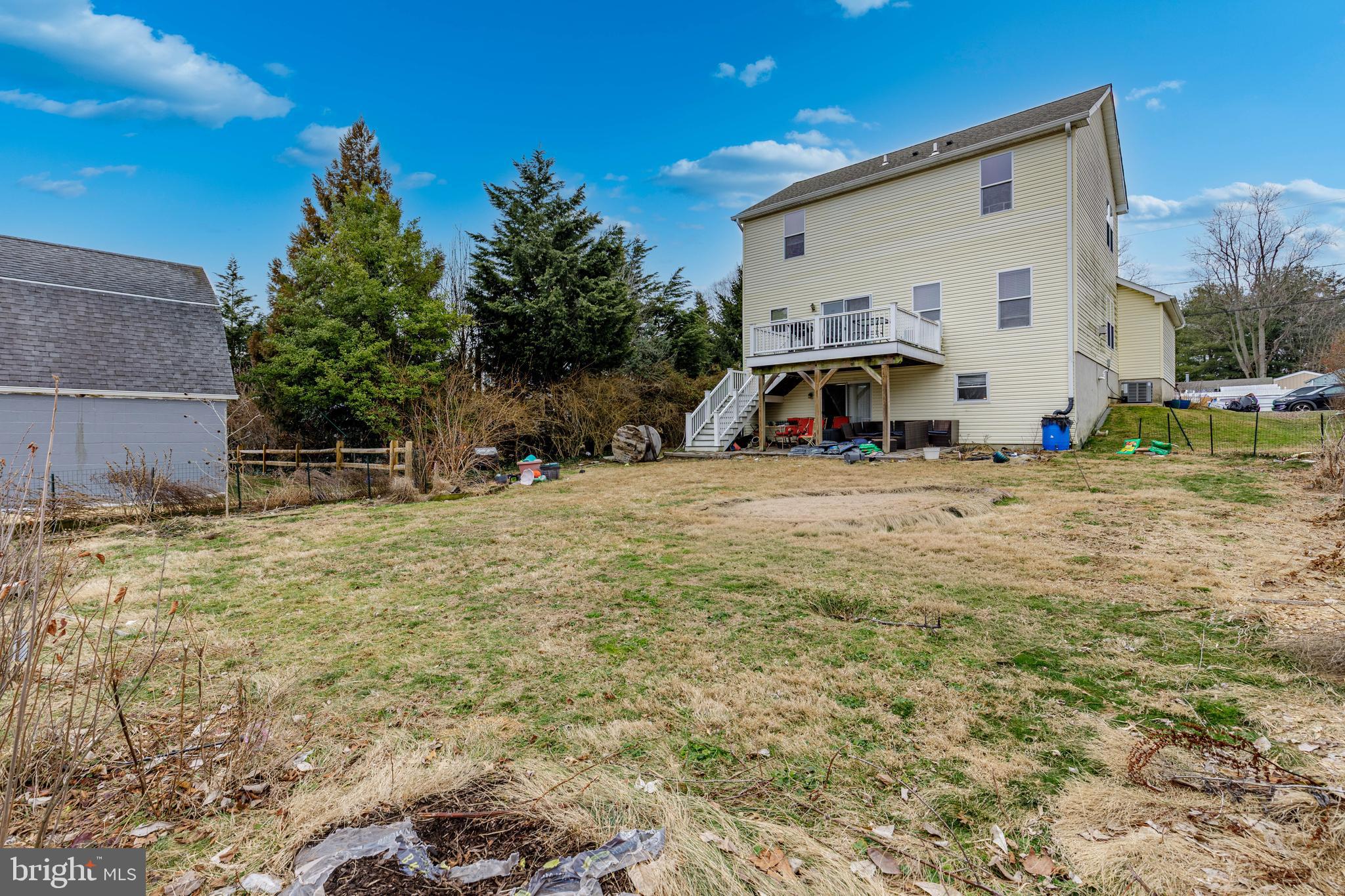 215 Birch Street Hamilton, NJ 08610 - Photo 11 of 38 a view of a house with backyard and trees