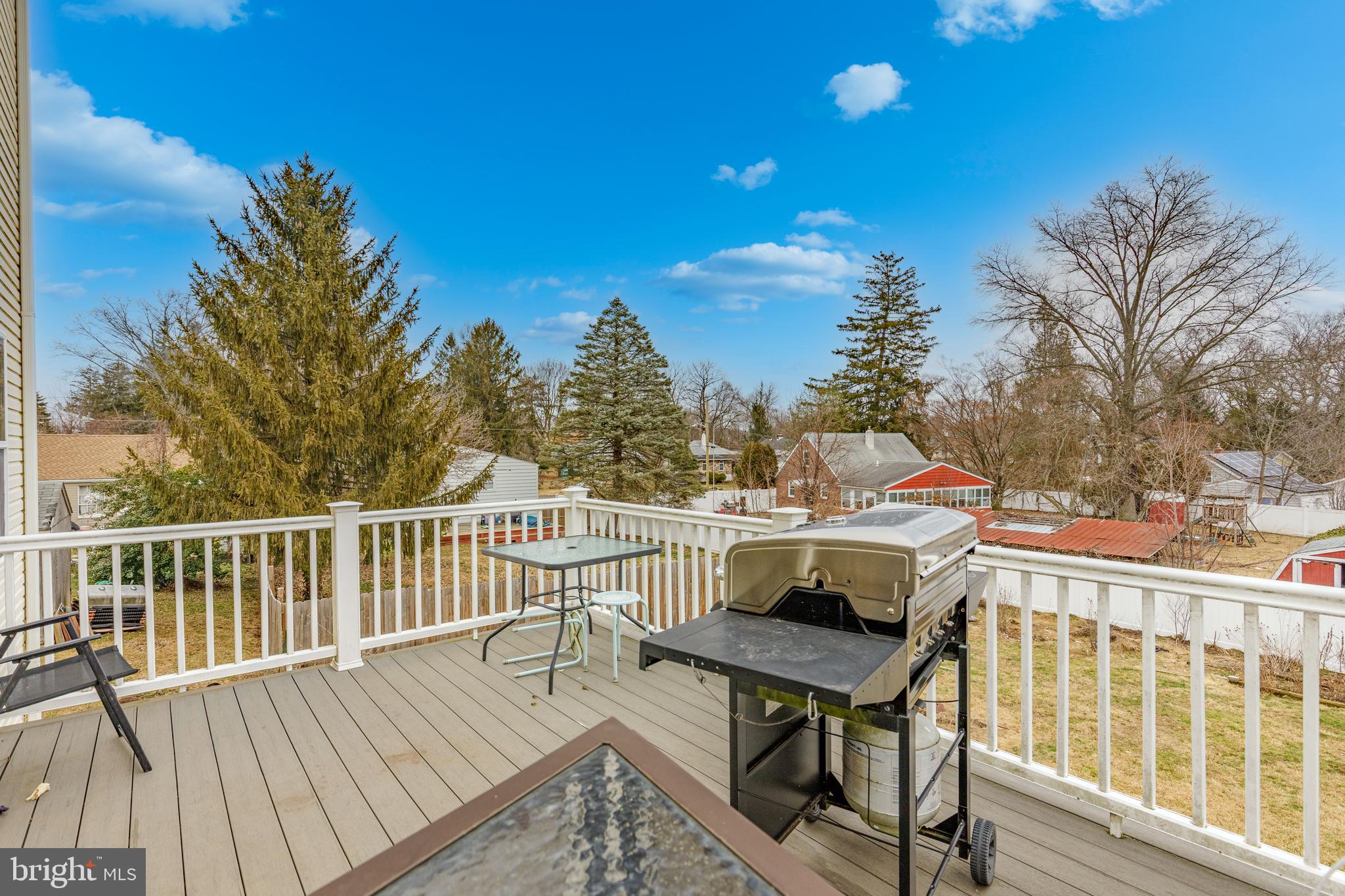 215 Birch Street Hamilton, NJ 08610 - Photo 14 of 38 a view of a deck with furniture and trees around