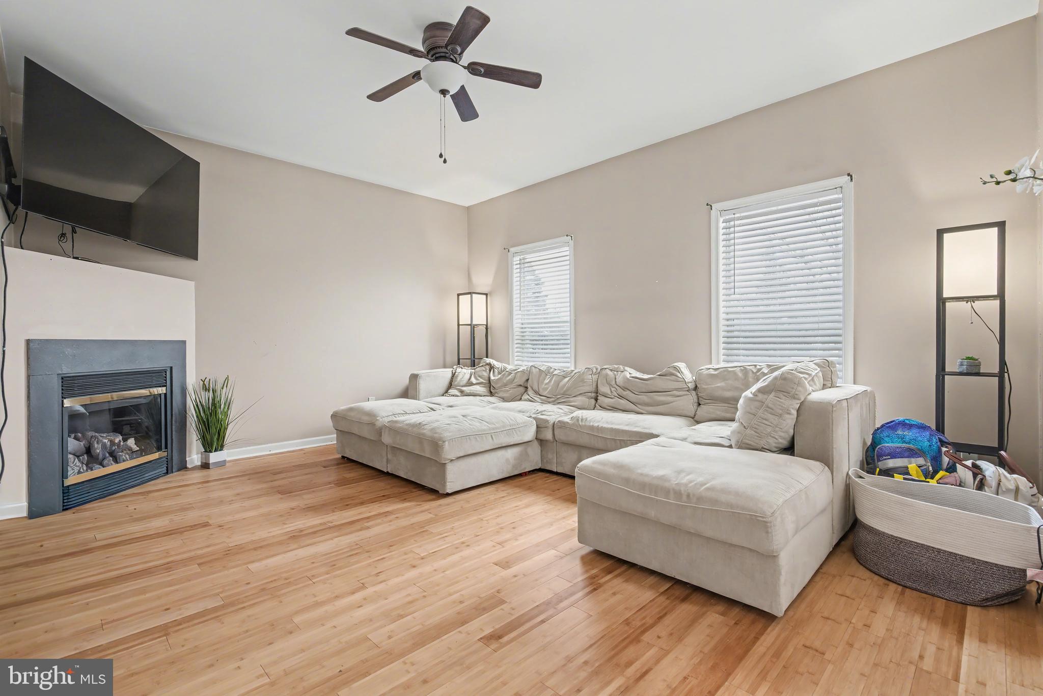 215 Birch Street Hamilton, NJ 08610 - Photo 23 of 38 a living room with furniture and a fireplace