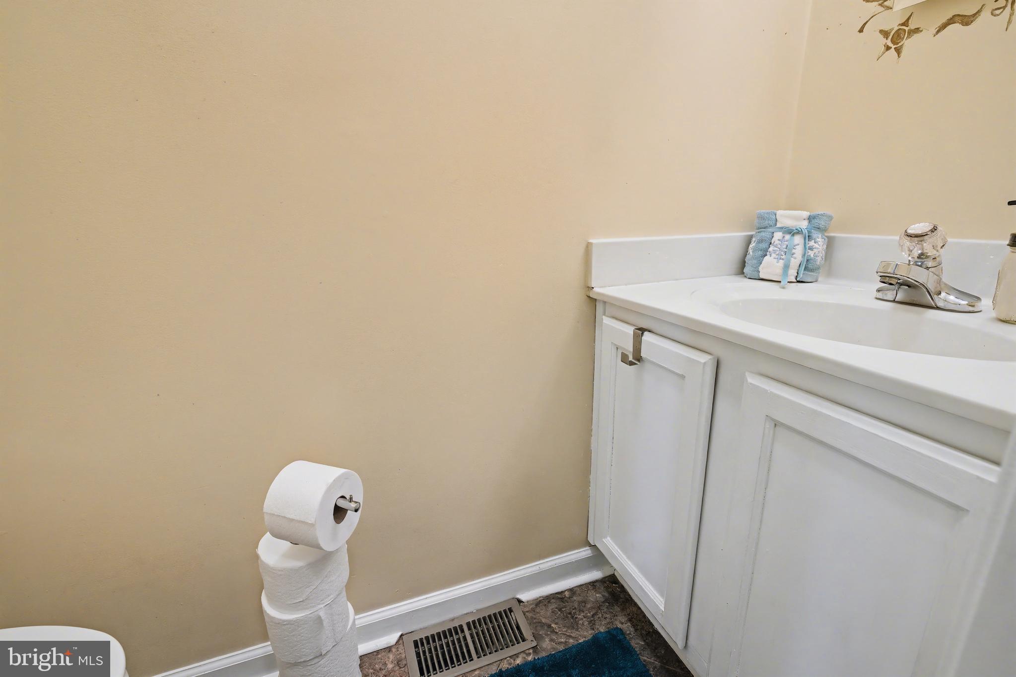 215 Birch Street Hamilton, NJ 08610 - Photo 26 of 38 a bathroom with a sink and vanity