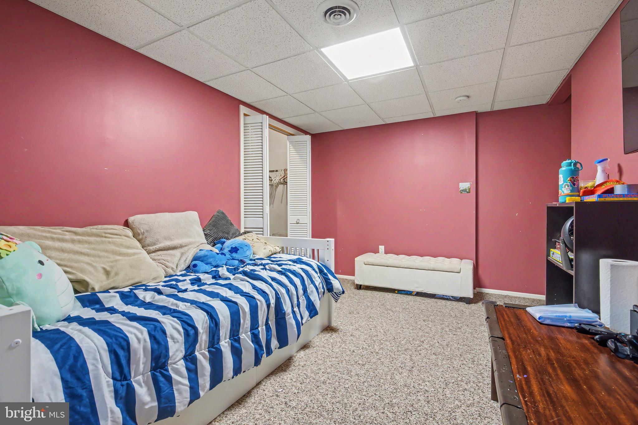 215 Birch Street Hamilton, NJ 08610 - Photo 31 of 38 a bedroom with a bed and a flat screen tv