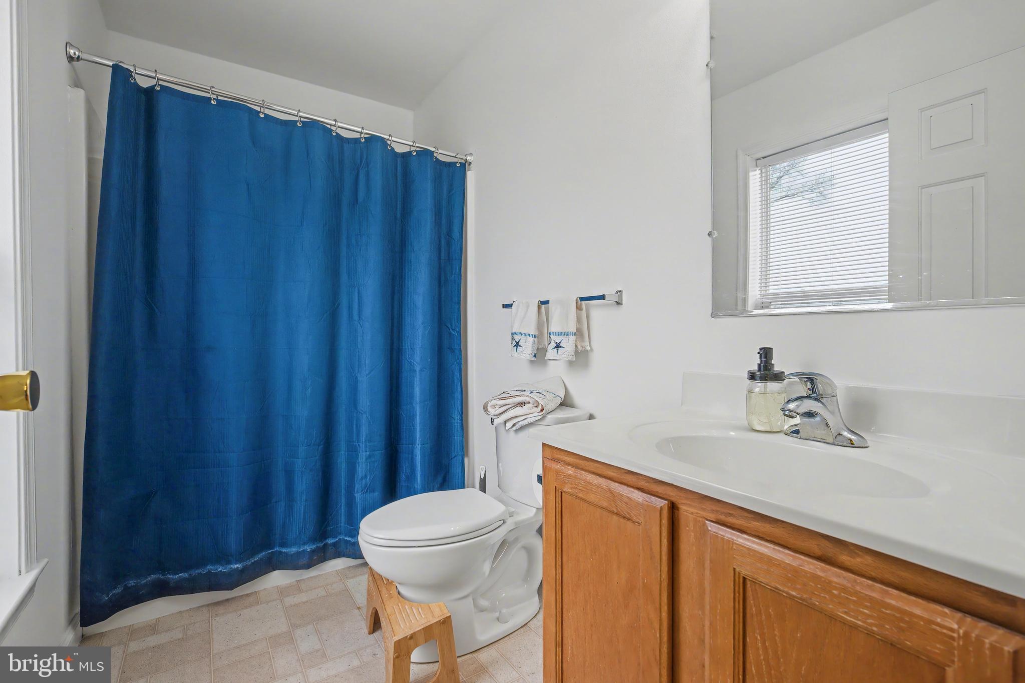 215 Birch Street Hamilton, NJ 08610 - Photo 34 of 38 a bathroom with a sink a toilet and shower