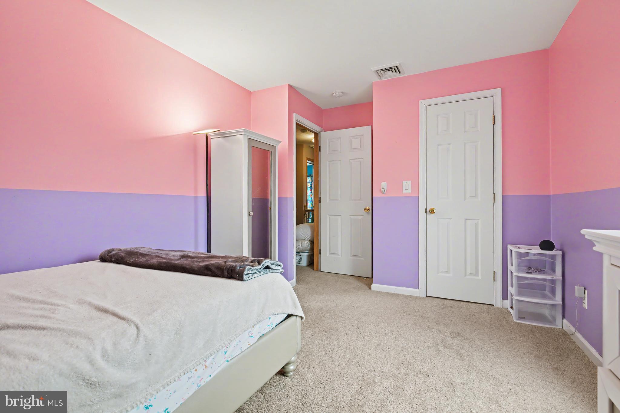 215 Birch Street Hamilton, NJ 08610 - Photo 35 of 38 a bed room with a bed and a mirror