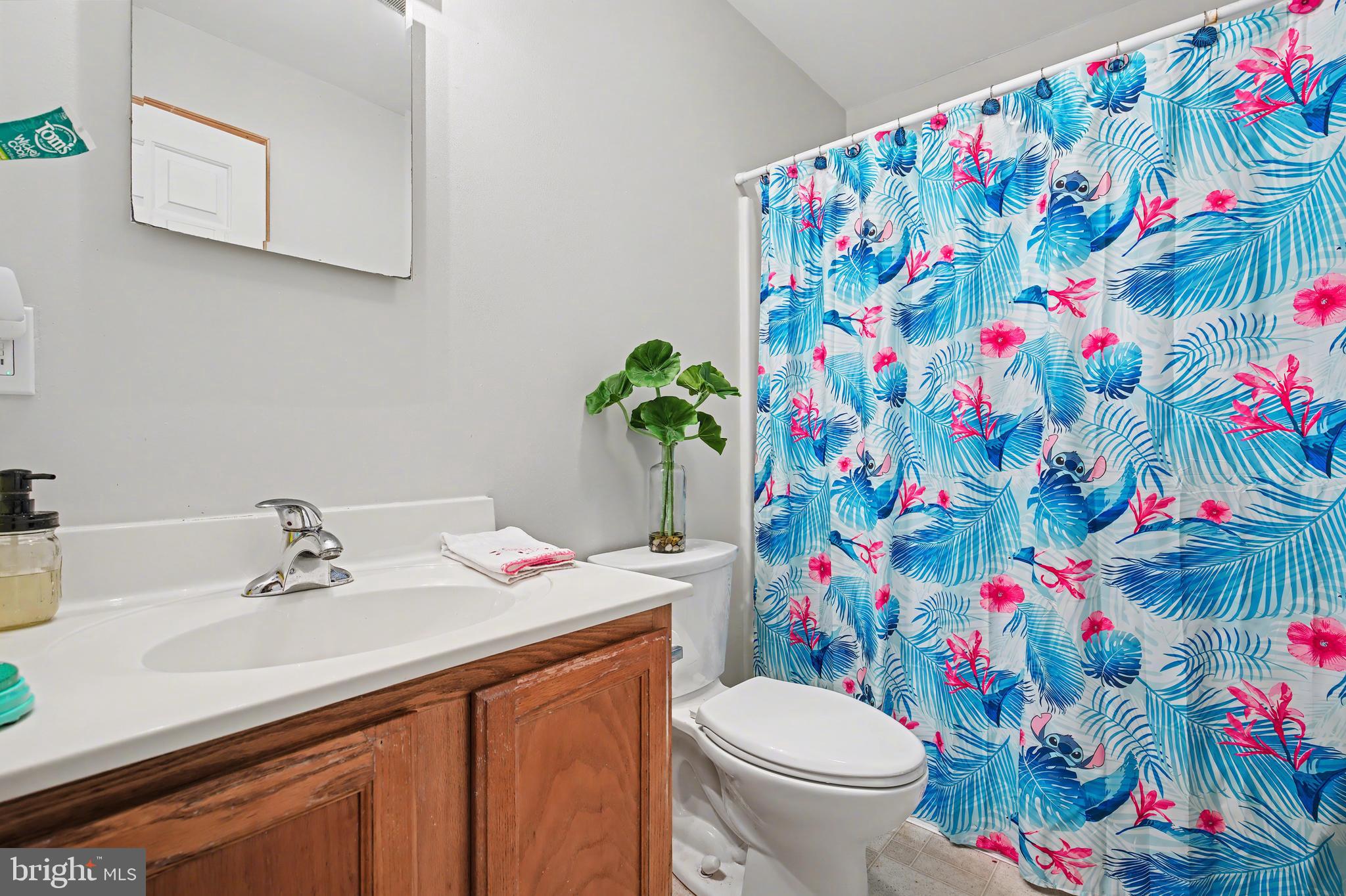 215 Birch Street Hamilton, NJ 08610 - Photo 5 of 38 a bathroom with a sink toilet and vanity