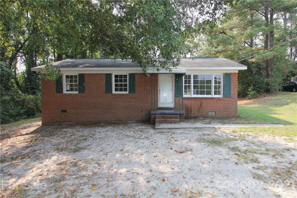 79 Short Town Road Morven, NC 28119 - Photo 1 of 18 a house with trees in the background