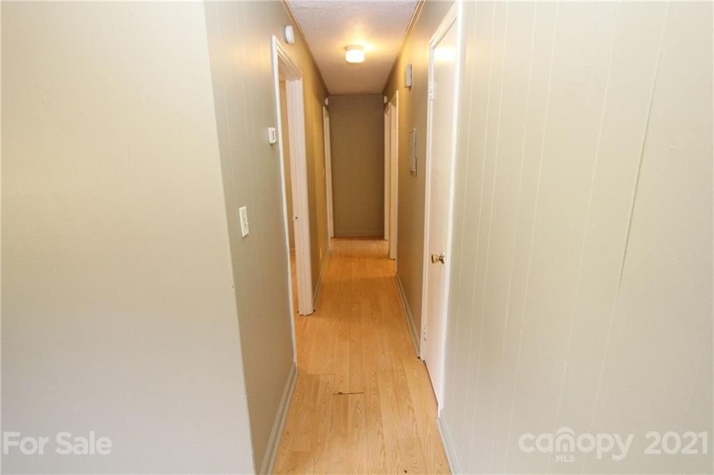79 Short Town Road Morven, NC 28119 - Photo 11 of 18 a view of a hallway with wooden floor