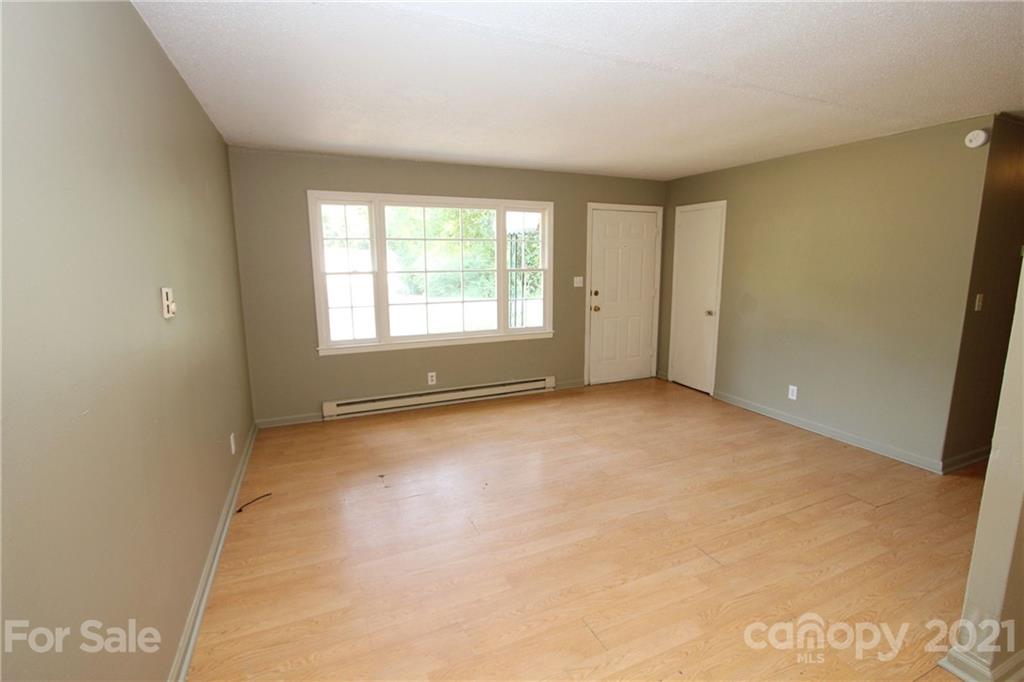 79 Short Town Road Morven, NC 28119 - Photo 7 of 18 an empty room with a empty space and windows