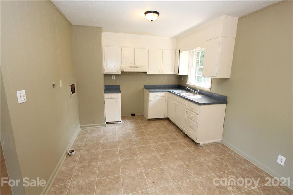 79 Short Town Road Morven, NC 28119 - Photo 9 of 18 a kitchen with stainless steel appliances granite countertop a sink stove and cabinets