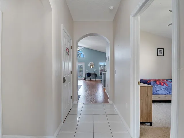a view of hallway with livingroom and furniture