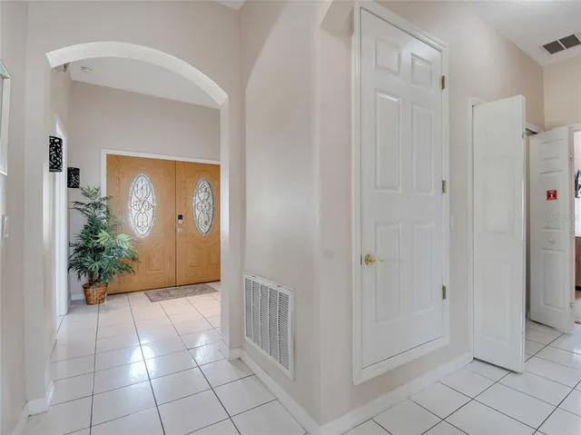 a view of a hallway to rooms