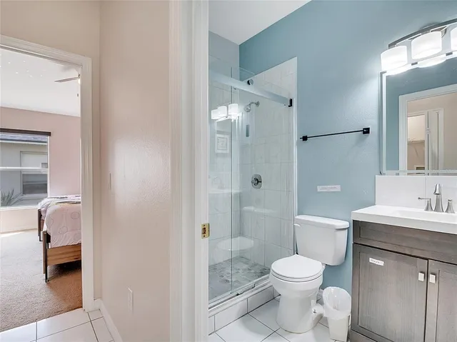 a bathroom with a toilet a sink and shower