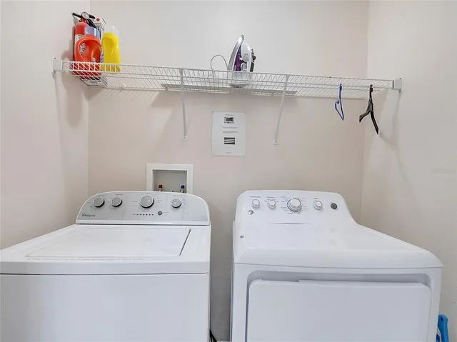 a utility room with dryer and washer