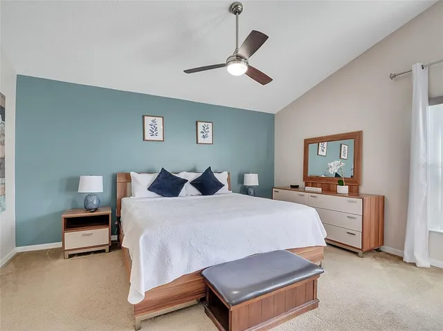 a bed room with a bed and a chandelier