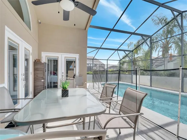 a view of a dining room with furniture wooden floor and a potted plant