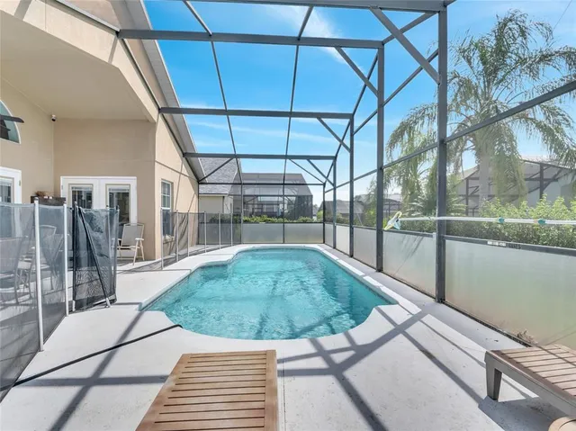 a view of a swimming pool with a patio