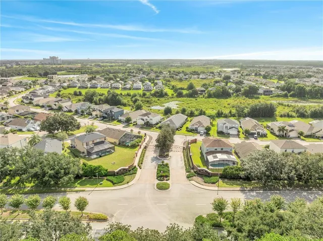 an aerial view of residential houses with outdoor space
