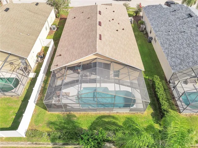 an aerial view of a multi story residential apartment building with yard