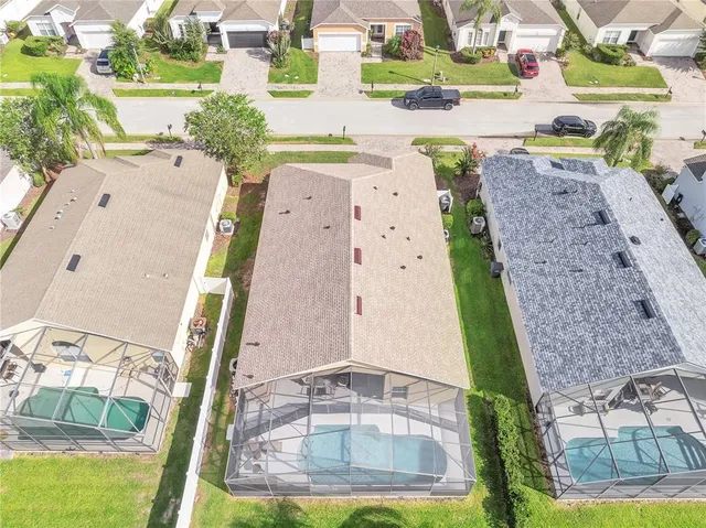 an aerial view of a house with a swimming pool