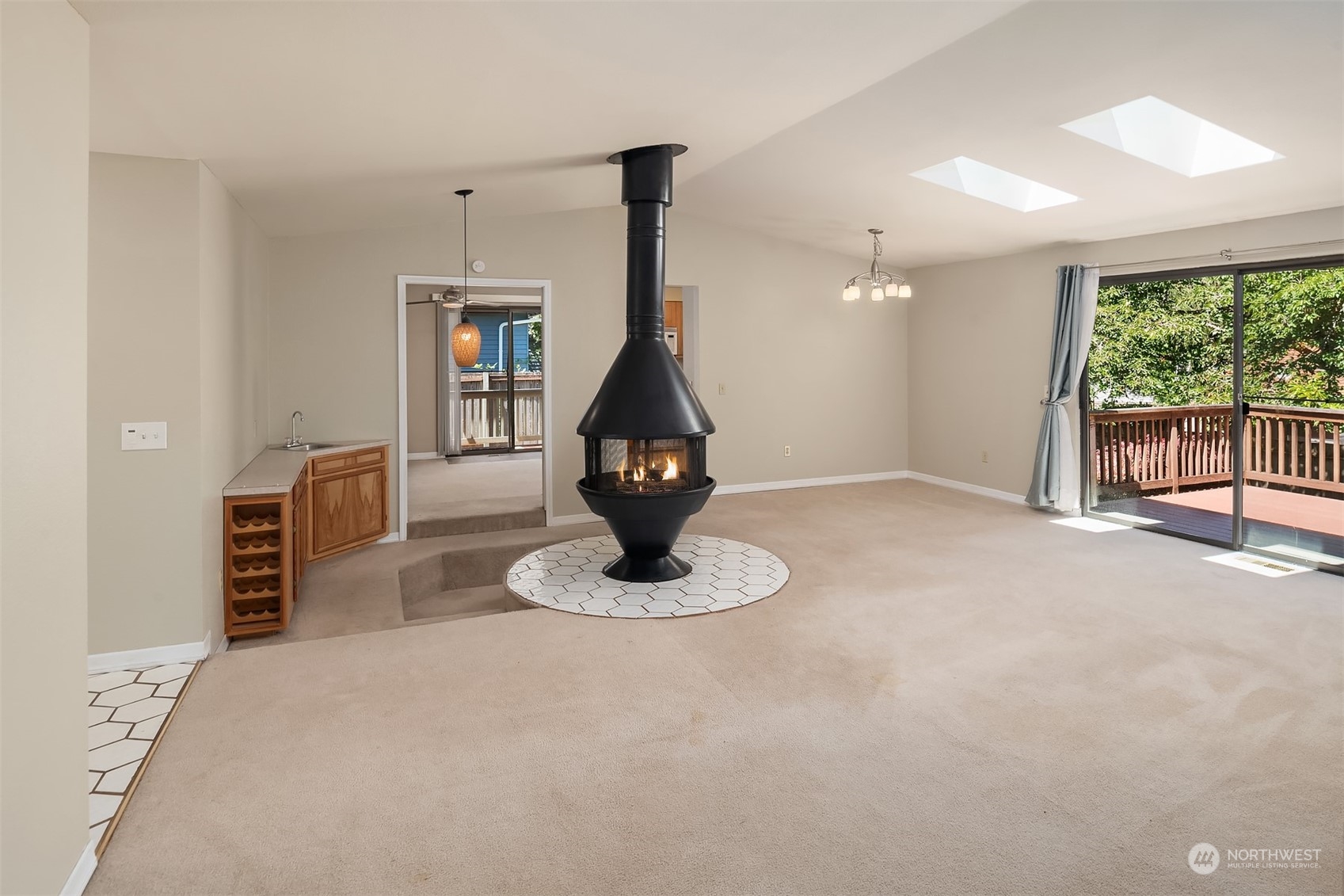 15412 Southeast 176th Place Renton, WA 98058 - Photo 2 of 6 a living room with furniture a window and a chandelier