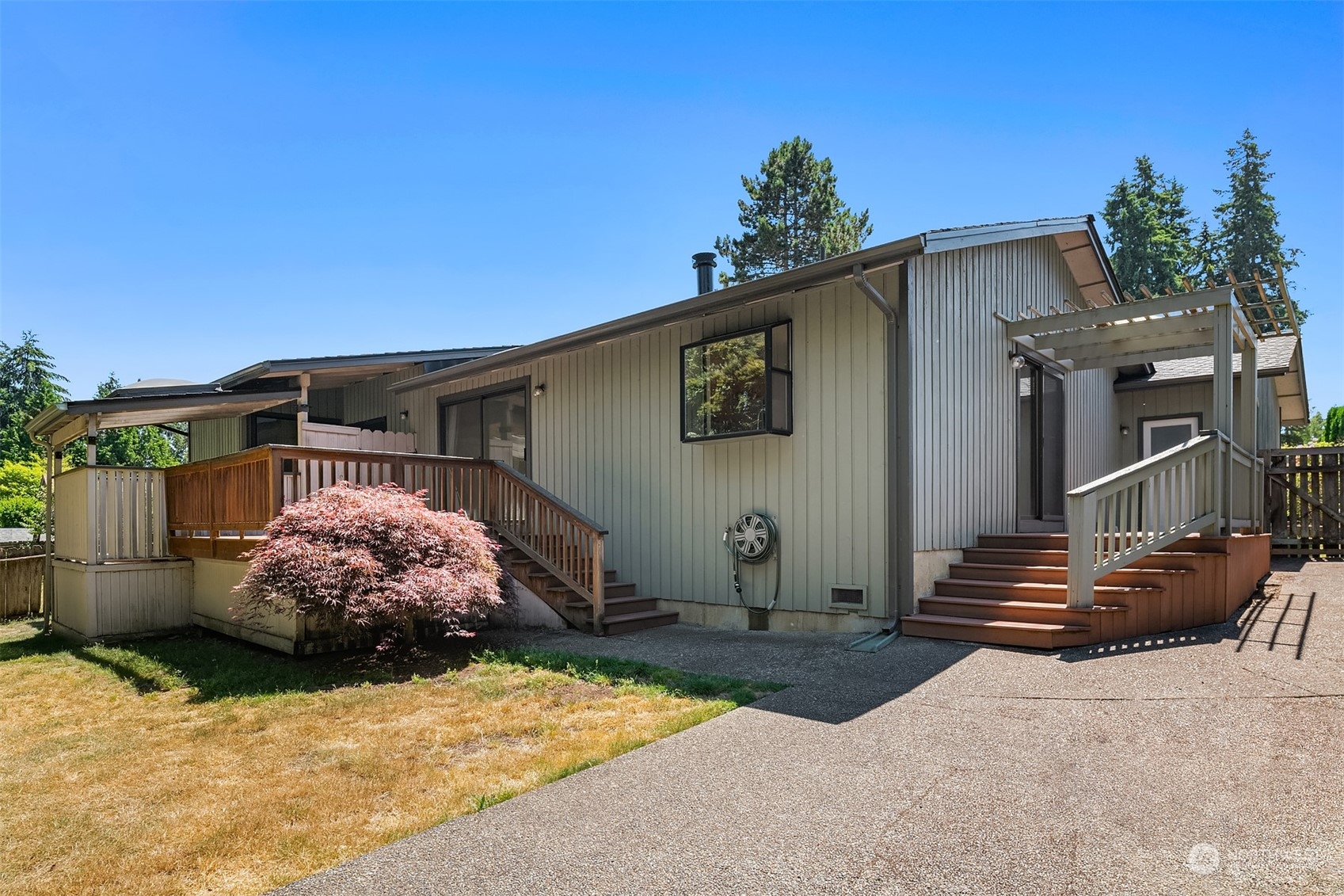 15412 Southeast 176th Place Renton, WA 98058 - Photo 6 of 6 a front view of a house with garden
