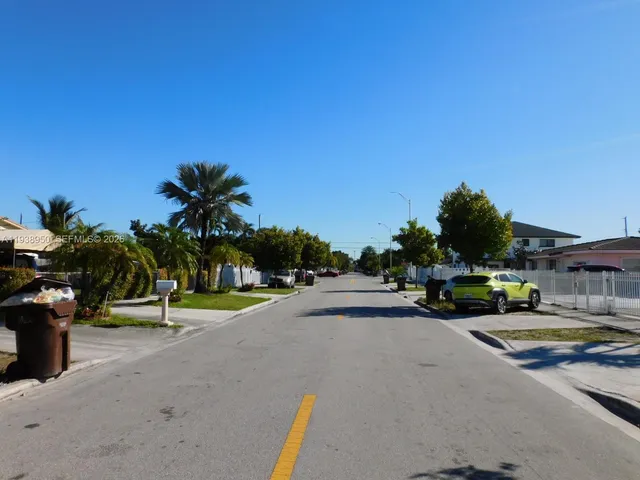 a view of a street with cars park