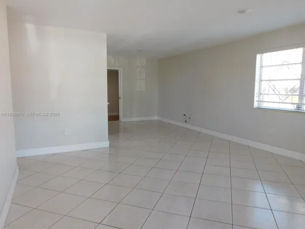 an empty room with white walls