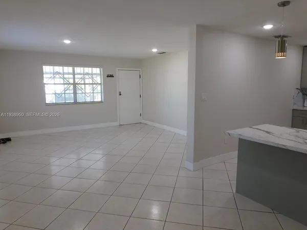 a view of an empty room and window