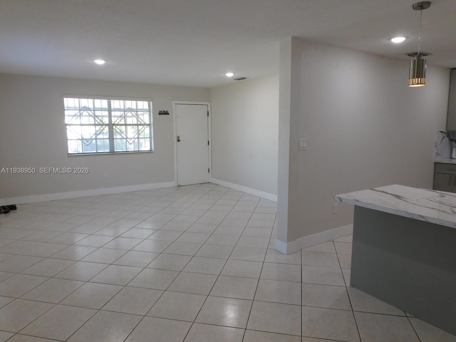 846 West 31st Street Hialeah, FL 33012 - Photo 5 of 21 Dining area view to living area and front entry.