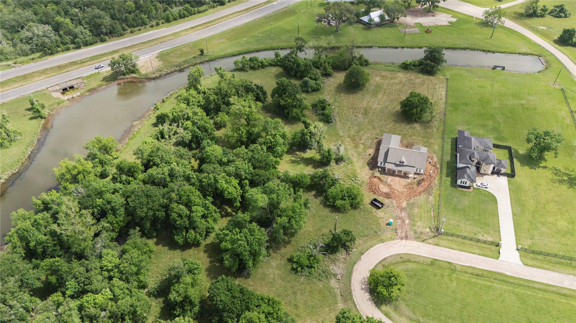 1127 Saddlehorn Bend Angleton, TX 77515 - Photo 17 of 23 an aerial view of a house with a yard and lake view