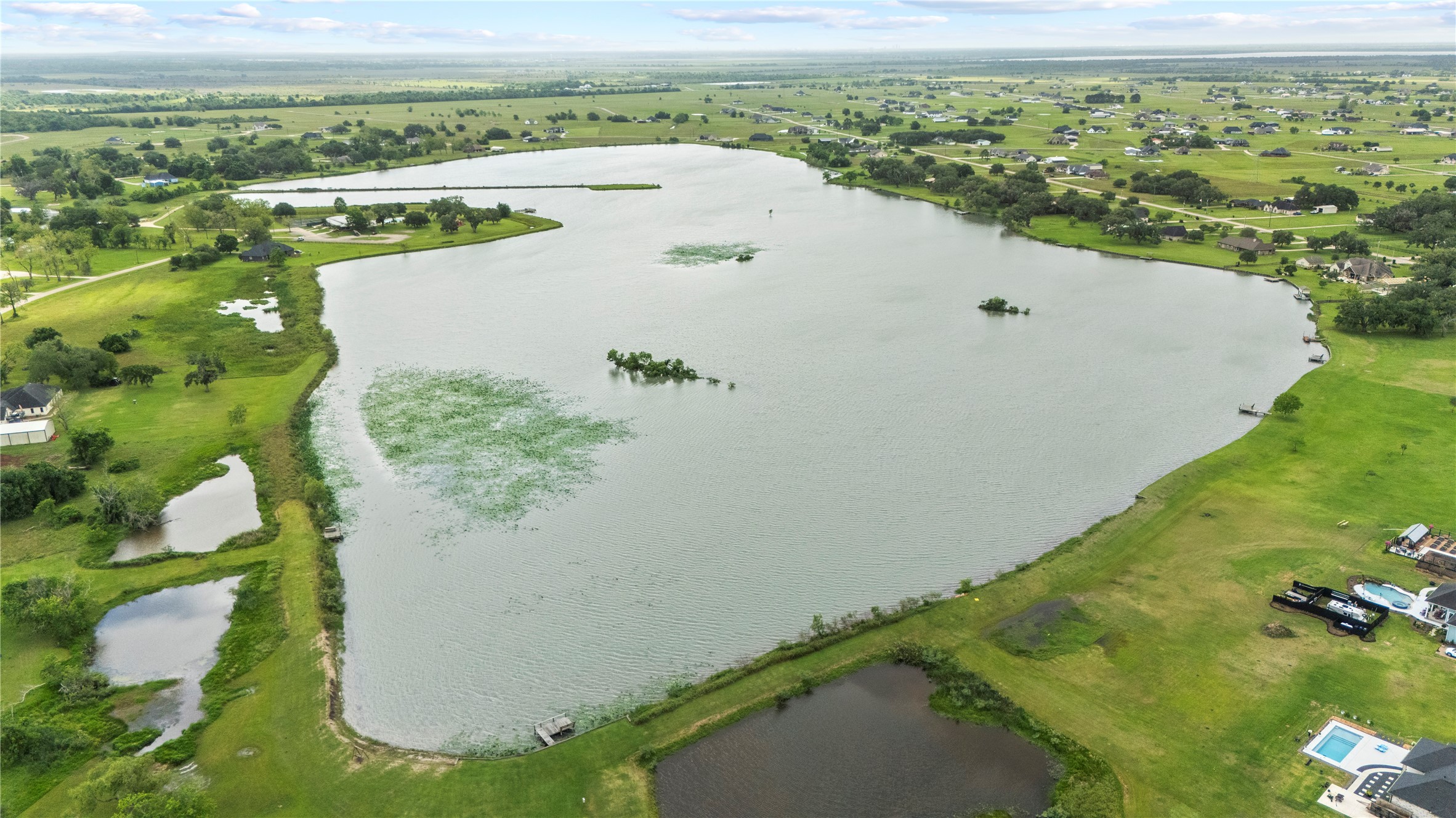 1127 Saddlehorn Bend Angleton, TX 77515 - Photo 19 of 23 a view of a lake with a mountain in the background