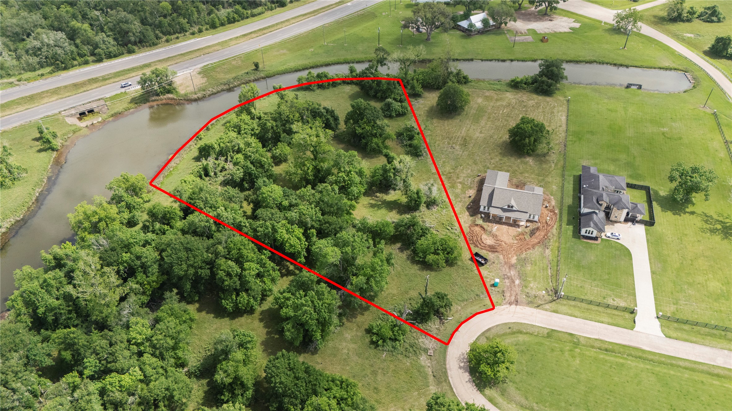 1127 Saddlehorn Bend Angleton, TX 77515 - Photo 4 of 23 an aerial view of a swimming pool with a yard and plants