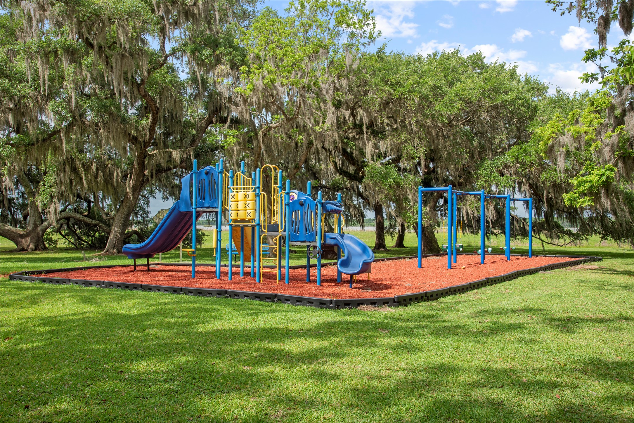 1127 Saddlehorn Bend Angleton, TX 77515 - Photo 9 of 23 a view of a park with slide