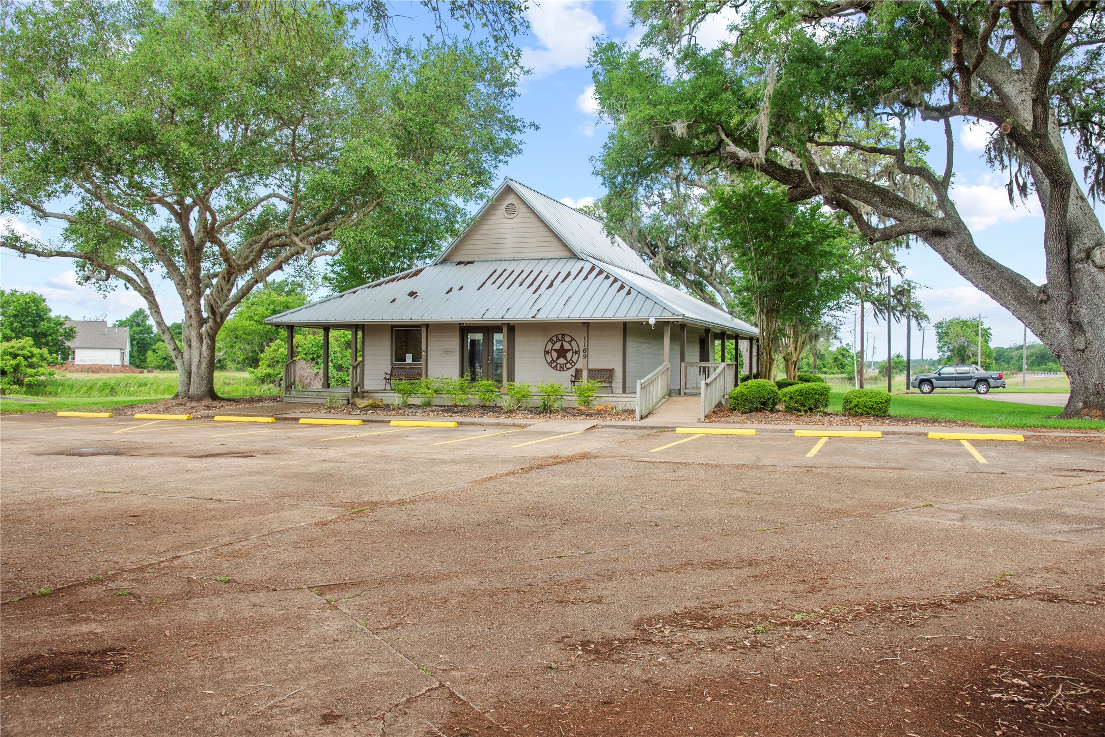 1127 Saddlehorn Bend Angleton, TX 77515 - Photo 10 of 23 a front view of a house with a yard