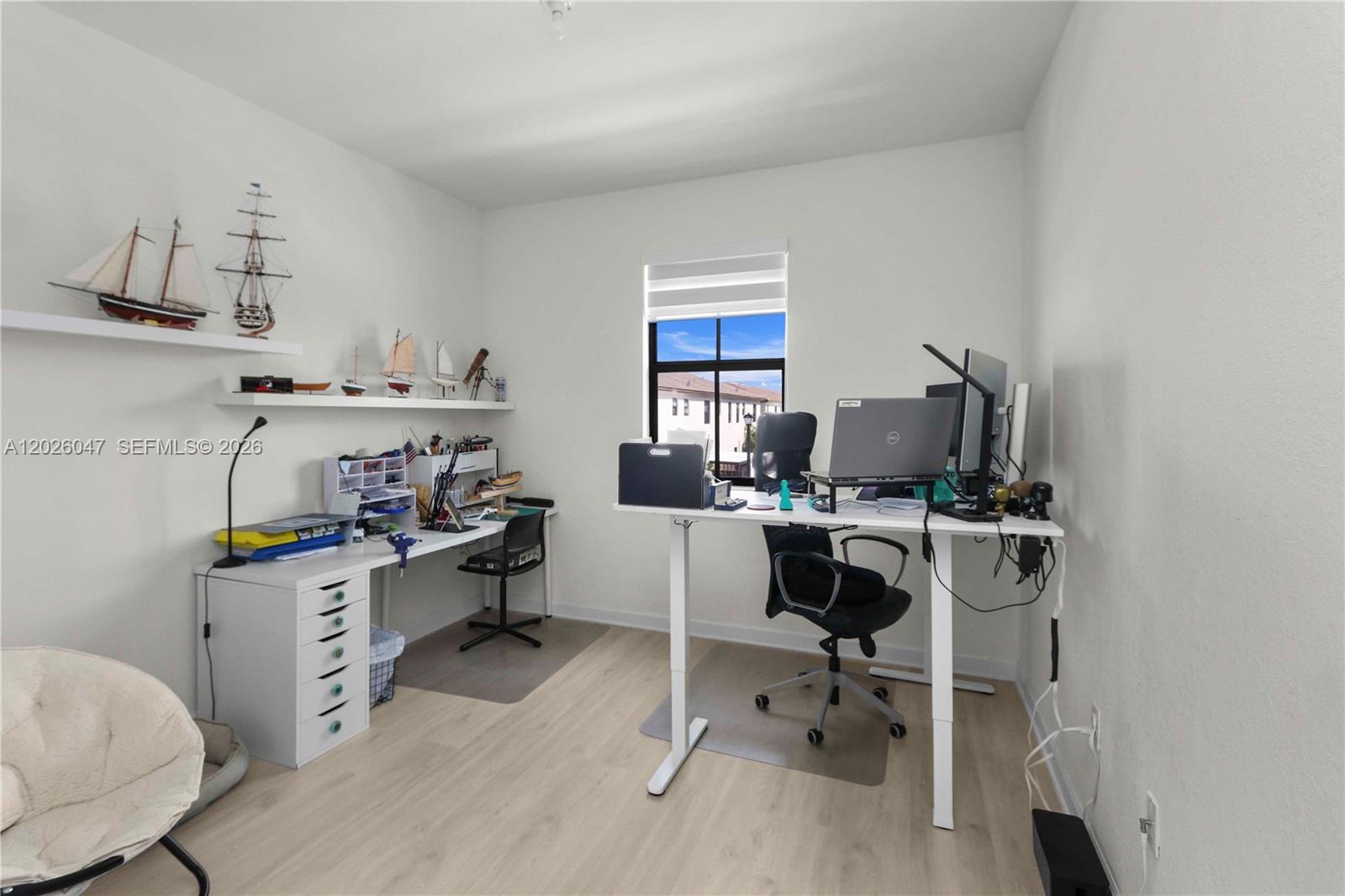 12862 Southwest 231st Street Miami, FL 33170 - Photo 24 of 30 a view of a workspace with furniture and a window
