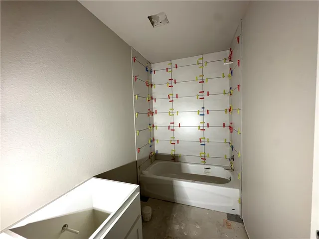 a bathroom with a sink and a shower
