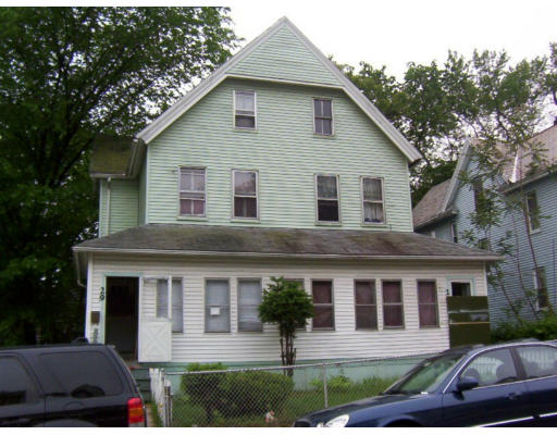 27-29 Windsor Street Springfield, MA 01105 - Photo 1 of 1 a view of a white house next to a yard