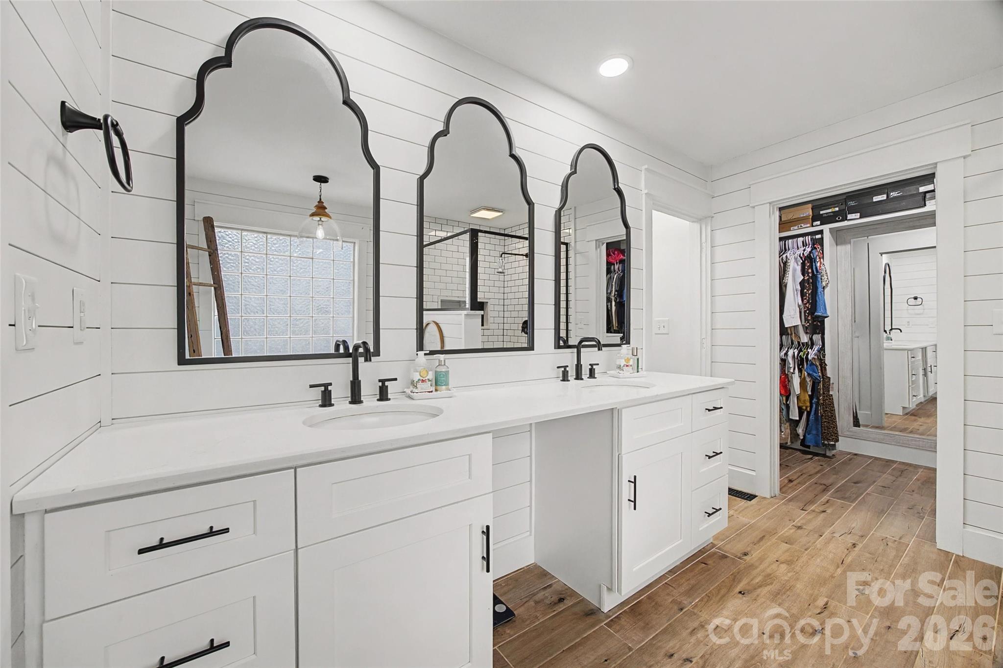 6396 Crosswinds Drive Clover, SC 29710 - Photo 18 of 47 a spacious bathroom with a double vanity sink and a mirror