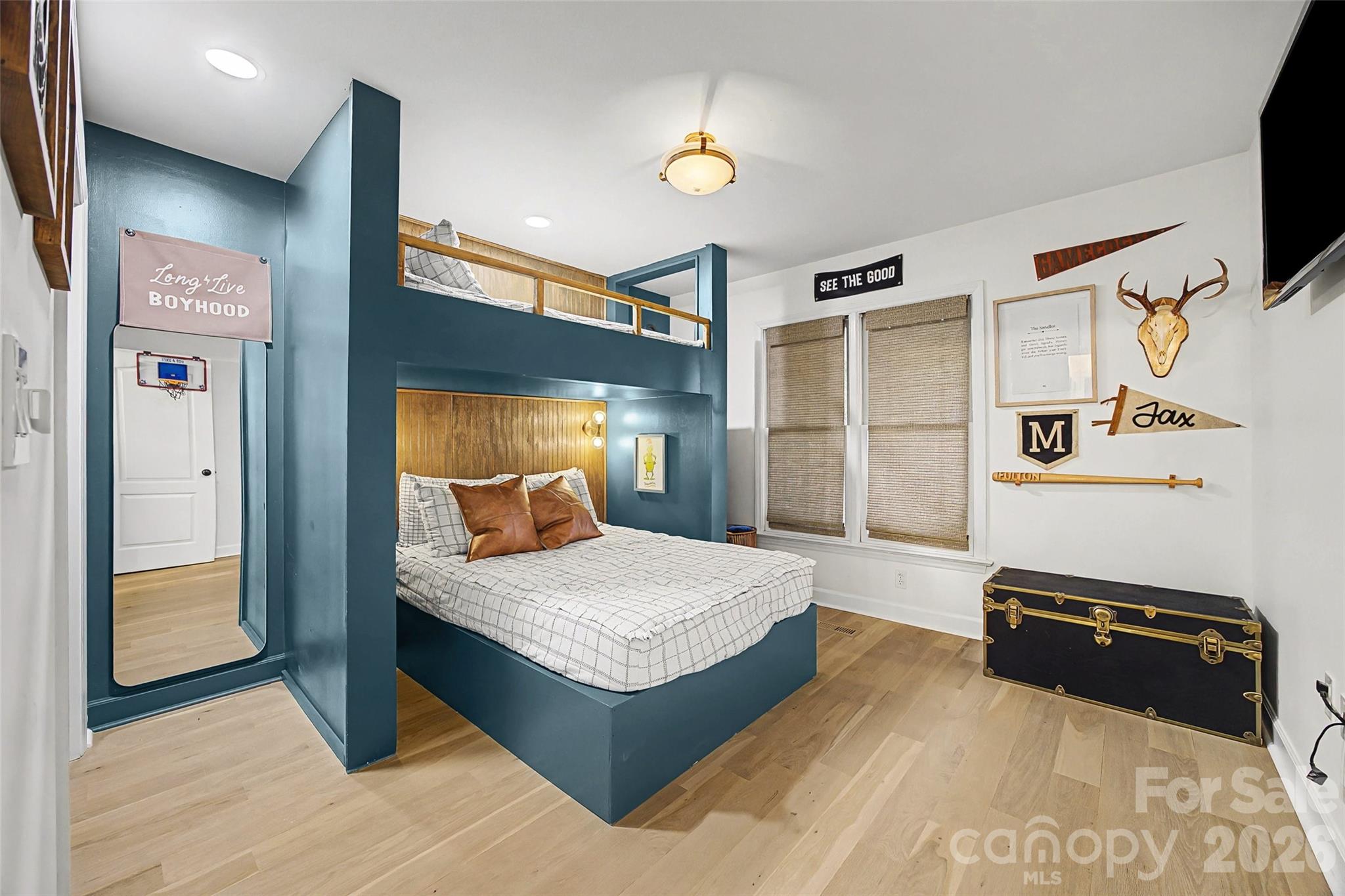 6396 Crosswinds Drive Clover, SC 29710 - Photo 22 of 47 a spacious bedroom with a bed and a flat screen tv