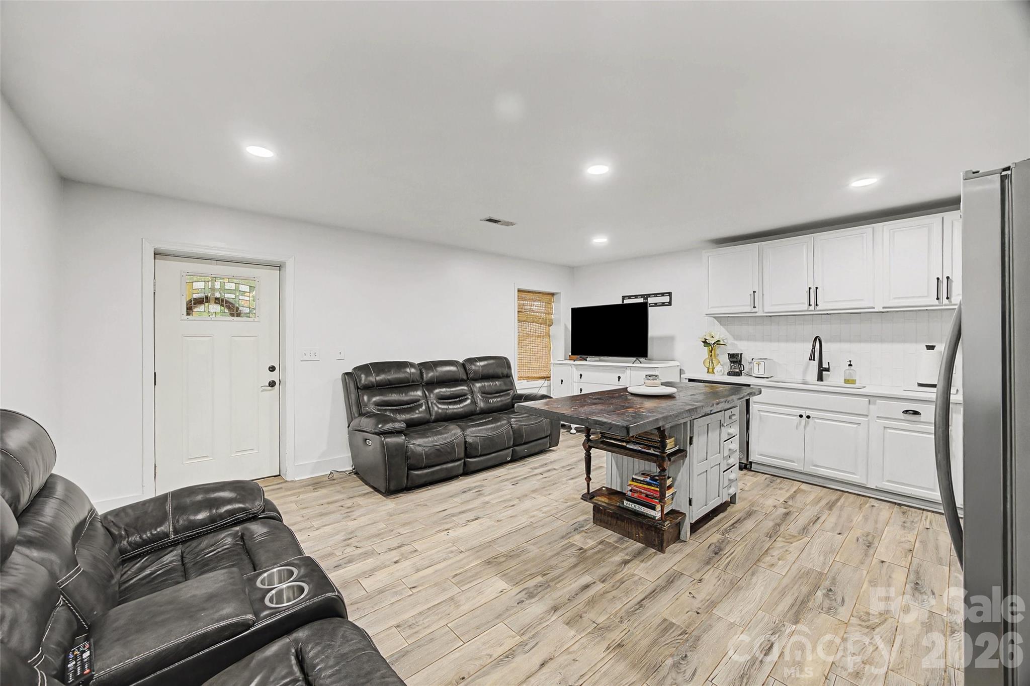 6396 Crosswinds Drive Clover, SC 29710 - Photo 31 of 47 a living room with furniture and a flat screen tv