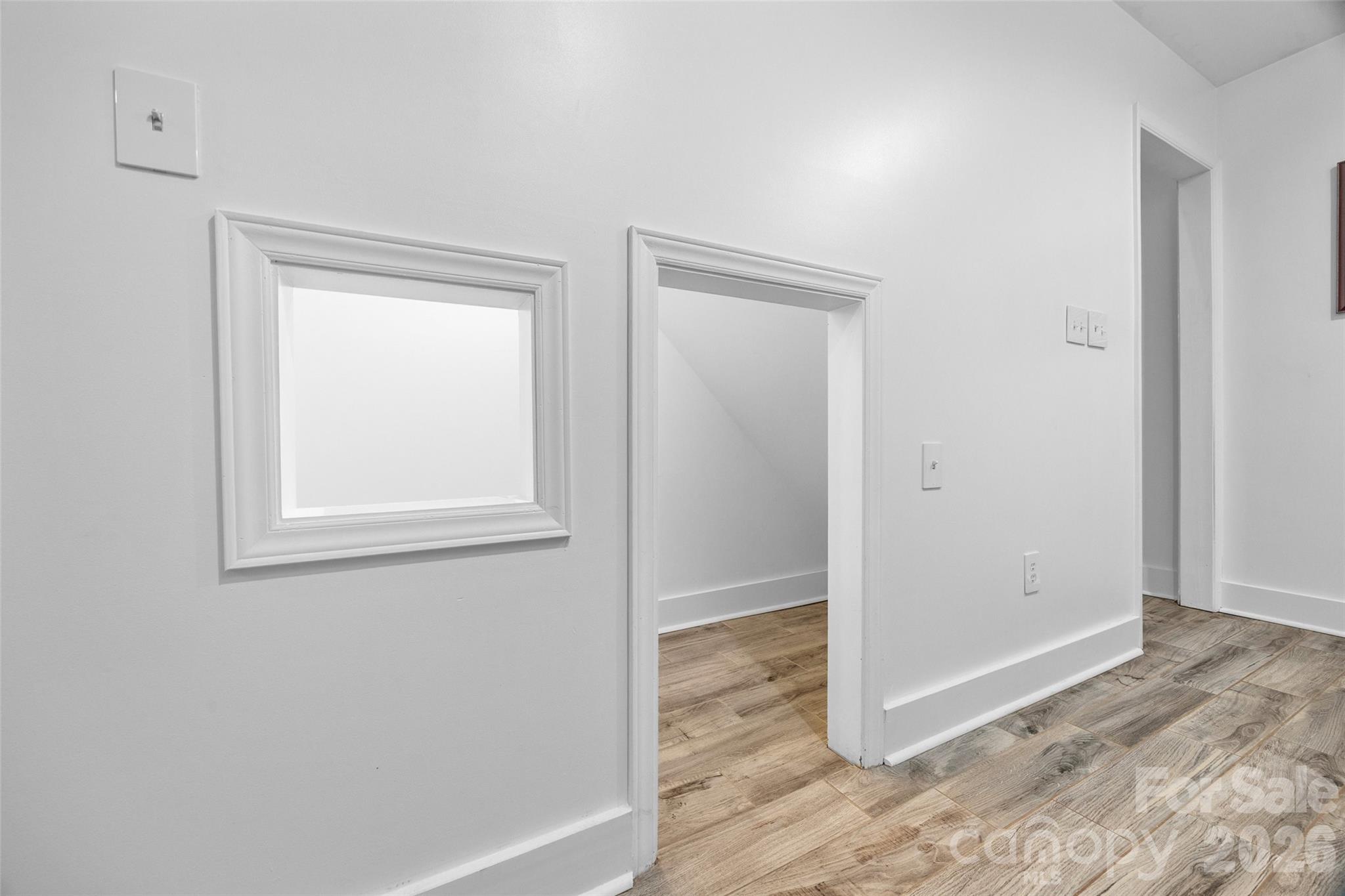 6396 Crosswinds Drive Clover, SC 29710 - Photo 39 of 47 an empty room with wooden floor closet and windows