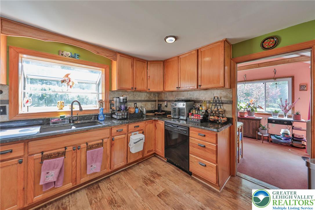 331 Cranberry Creek Road Cresco, PA 18326 - Photo 14 of 95 A well-equipped kitchen featuring hardwood floors and ample cabinetry.