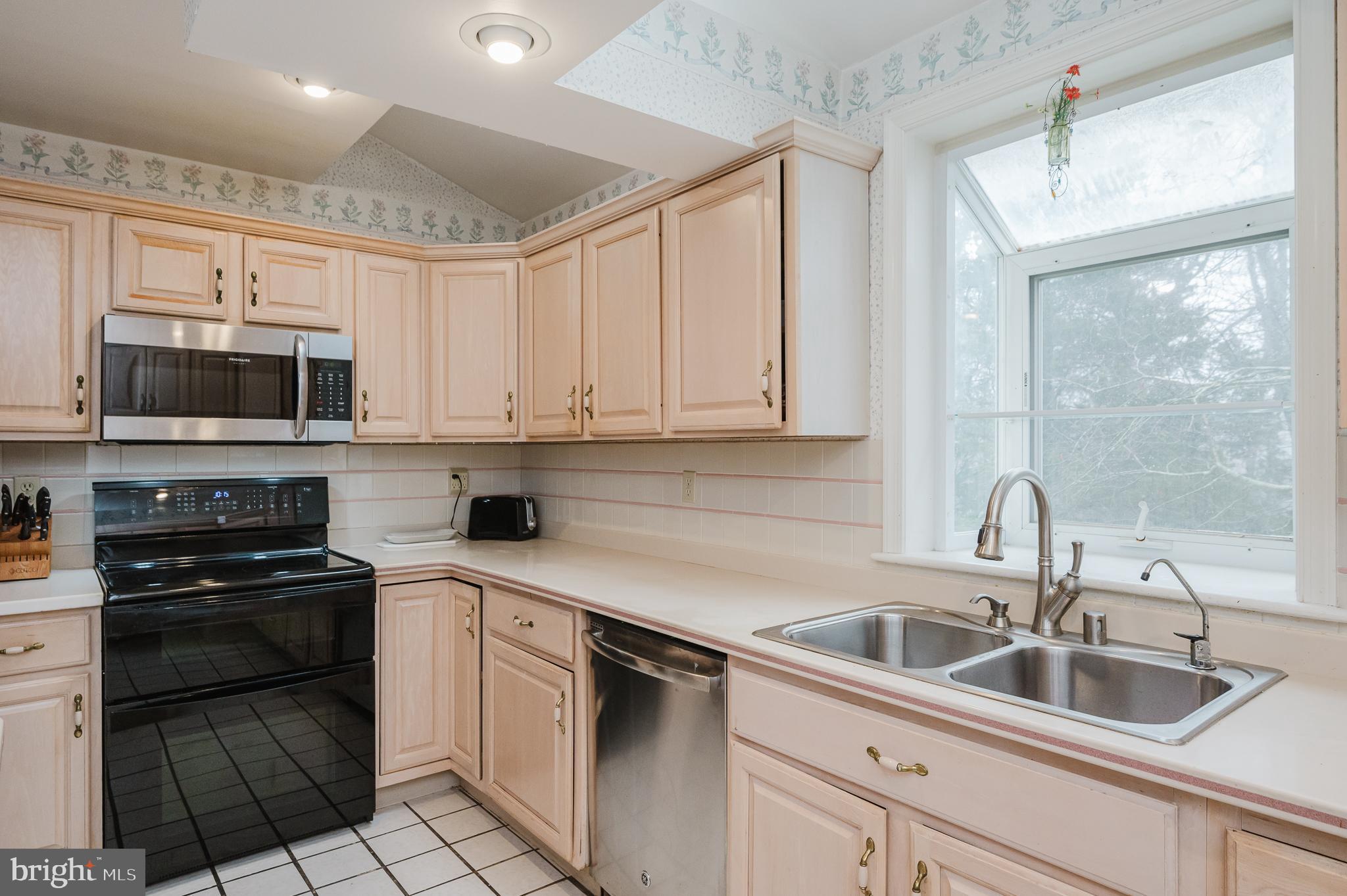 1303 Mill Creek Road Fallston, MD 21047 - Photo 12 of 58 a kitchen with appliances a sink and cabinets
