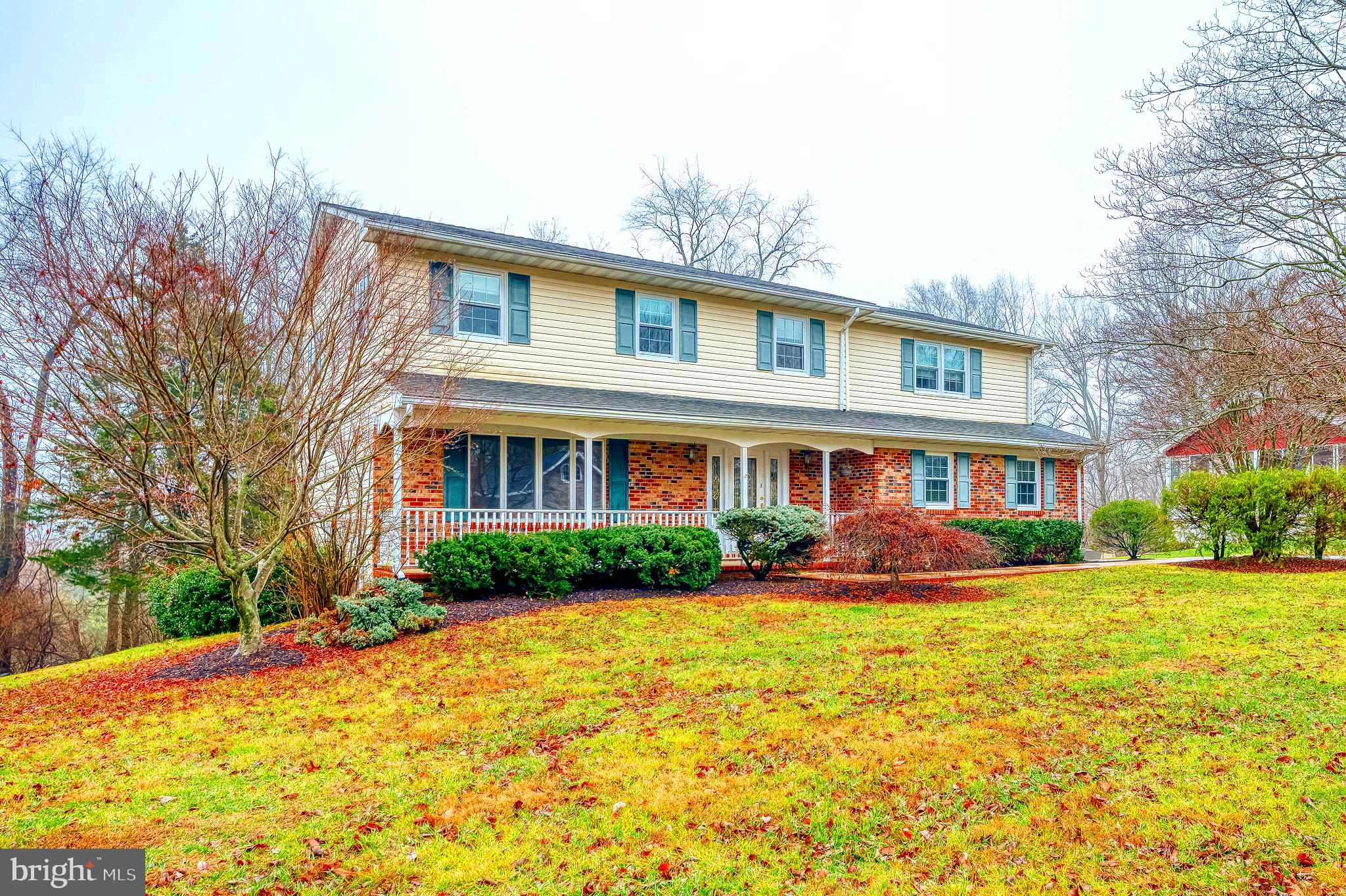 1303 Mill Creek Road Fallston, MD 21047 - Photo 2 of 58 a front view of brick house with a yard