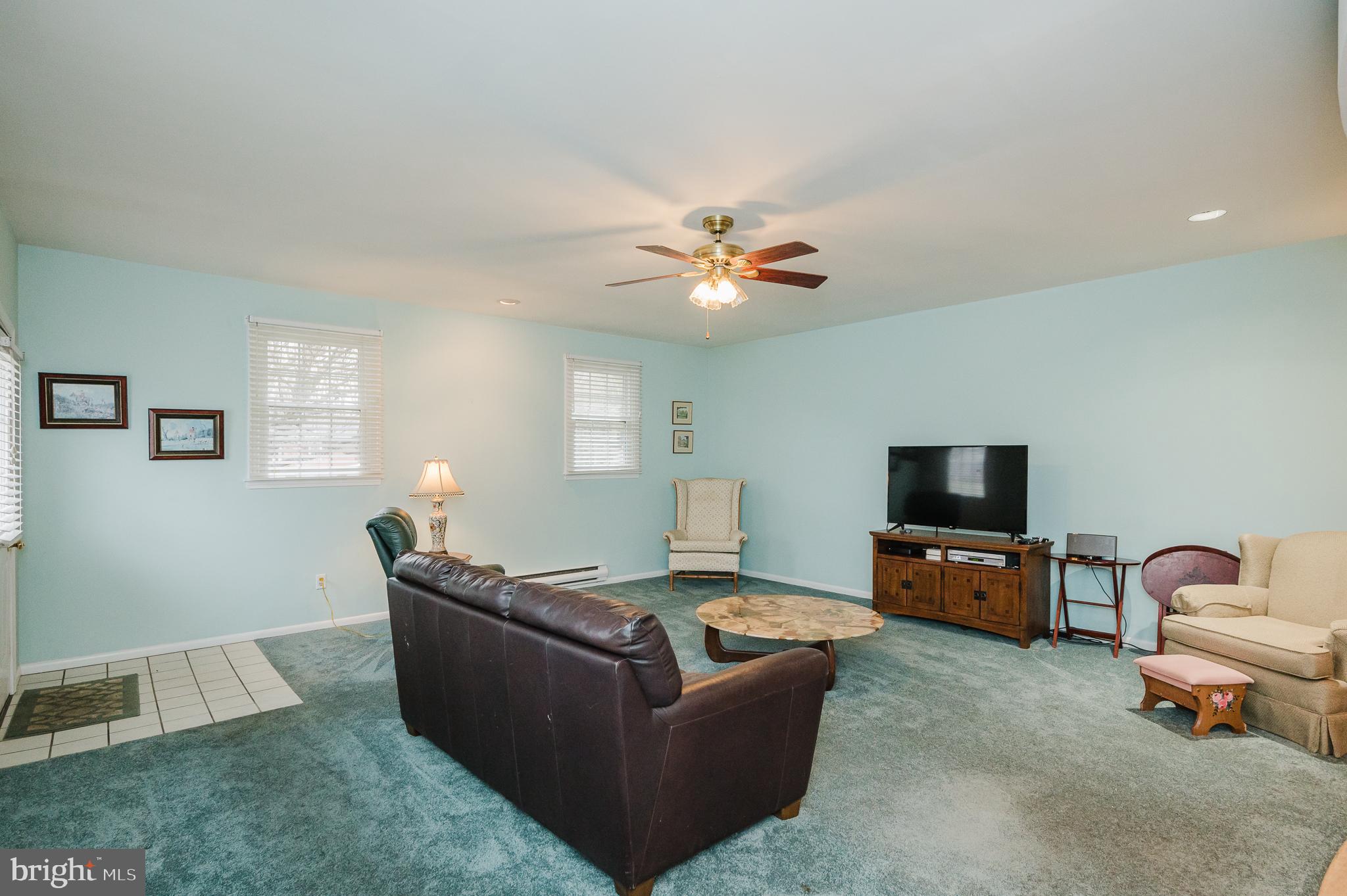 1303 Mill Creek Road Fallston, MD 21047 - Photo 24 of 58 a living room with furniture and a flat screen tv