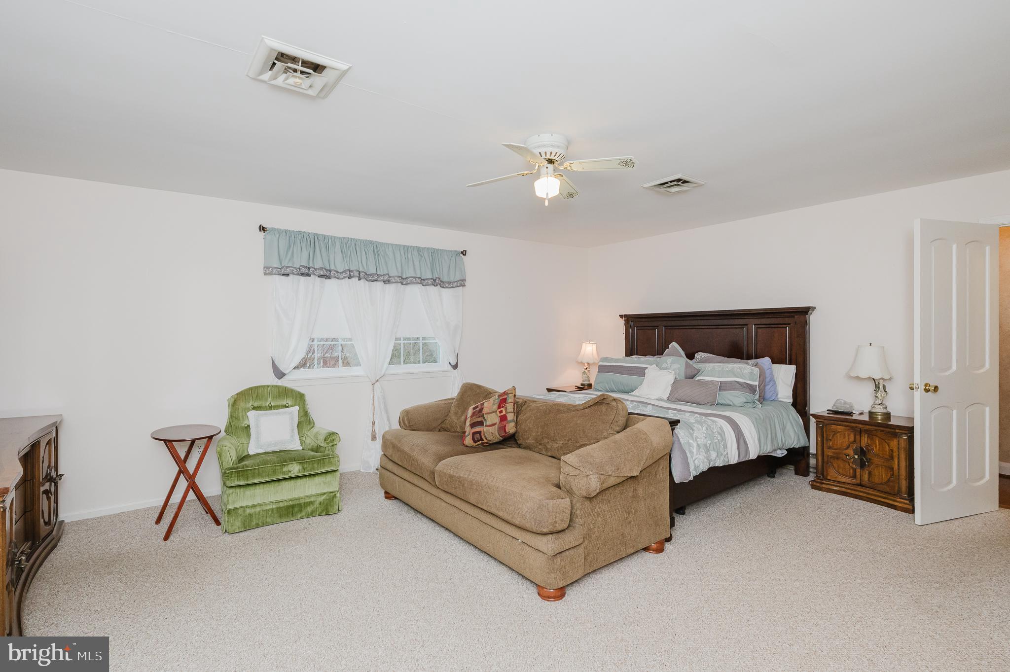 1303 Mill Creek Road Fallston, MD 21047 - Photo 30 of 58 a bedroom with bed and a couch