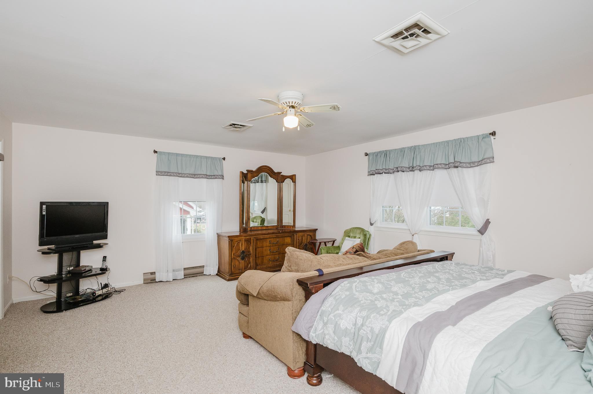 1303 Mill Creek Road Fallston, MD 21047 - Photo 33 of 58 a bedroom with a bed and a flat screen tv